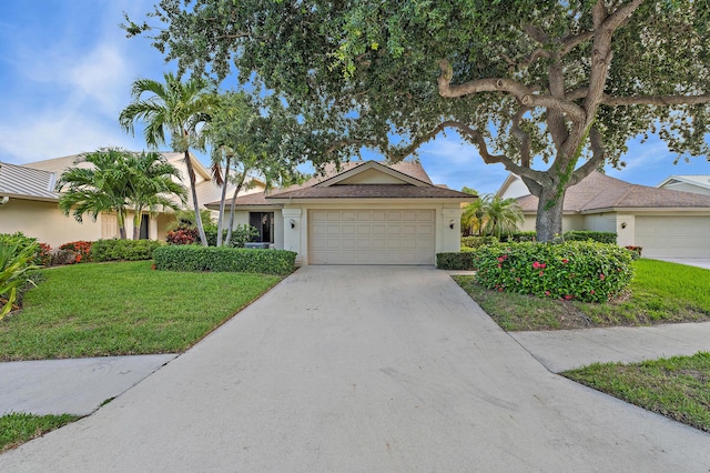 348 River Edge Rd, Jupiter, FL 33477 - ranch-style house with an attached garage, driveway, a front yard, and stucco siding