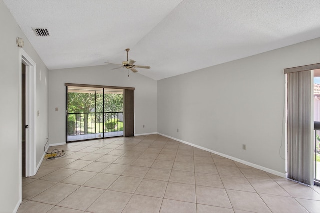 400 Club Cir Unit 201, Boca Raton, FL 33487 - spare room with a ceiling fan, vaulted ceiling, light tile patterned floors, and a textured ceiling