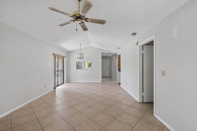 400 Club Cir Unit 201, Boca Raton, FL 33487 - spare room with vaulted ceiling, light tile patterned flooring, ceiling fan, a textured ceiling, and a chandelier