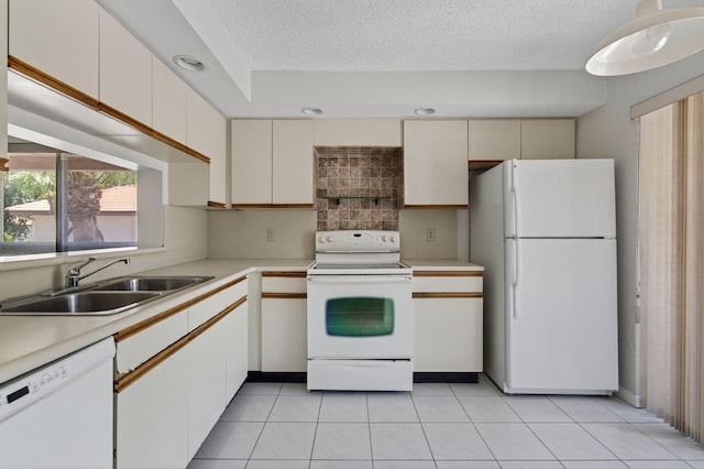 400 Club Cir Unit 201, Boca Raton, FL 33487 - kitchen featuring white appliances, light countertops, a textured ceiling, light tile patterned flooring, and tasteful backsplash