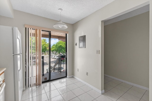 400 Club Cir Unit 201, Boca Raton, FL 33487 - doorway with light tile patterned floors and a textured ceiling