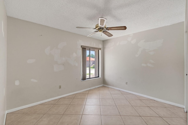 400 Club Cir Unit 201, Boca Raton, FL 33487 - spare room with a ceiling fan, a textured ceiling, and light tile patterned floors