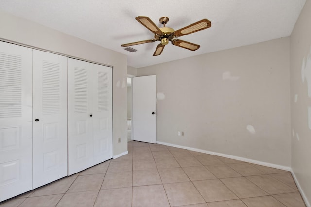 400 Club Cir Unit 201, Boca Raton, FL 33487 - unfurnished bedroom with a closet, light tile patterned floors, and a ceiling fan