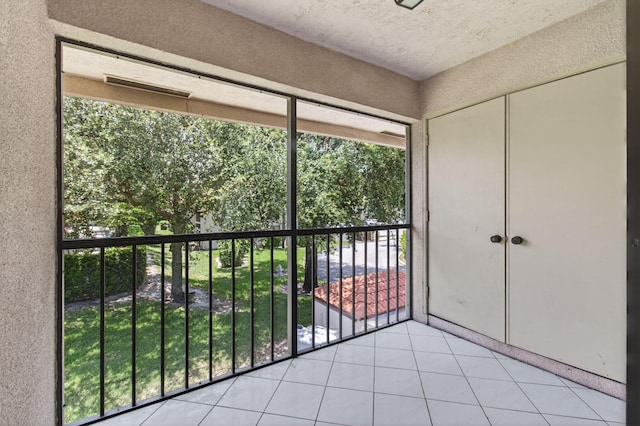 400 Club Cir Unit 201, Boca Raton, FL 33487 - unfurnished bedroom with multiple windows, light tile patterned floors, and a closet