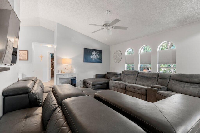 2997 SW Collings Dr, Port Saint Lucie, FL 34953 - living area featuring lofted ceiling, ceiling fan, and a textured ceiling