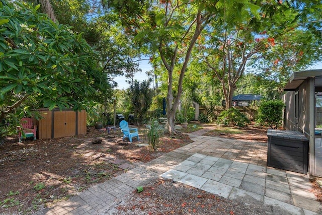 2997 SW Collings Dr, Port Saint Lucie, FL 34953 - fenced backyard with a shed and a patio