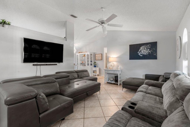 2997 SW Collings Dr, Port Saint Lucie, FL 34953 - living room featuring vaulted ceiling, a textured ceiling, light tile patterned floors, and ceiling fan