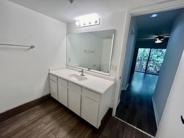 1100 Scotia Dr Unit 102, Hypoluxo, FL 33462 - bathroom with wood finished floors, vanity, and a ceiling fan