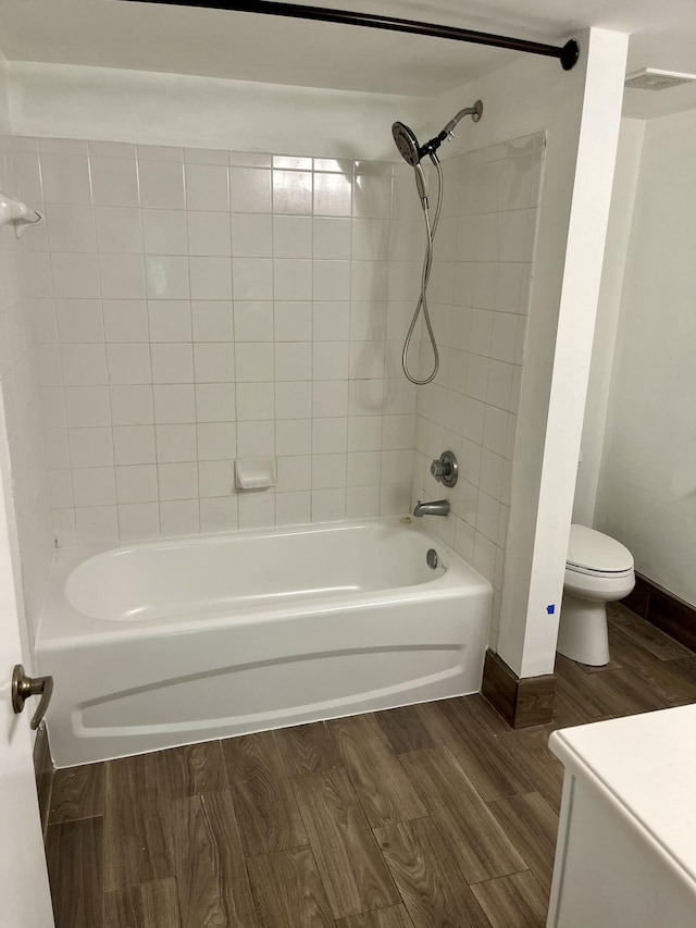 1100 Scotia Dr Unit 102, Hypoluxo, FL 33462 - full bathroom featuring wood finished floors, shower / bath combination, and vanity