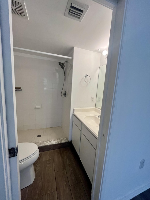 1100 Scotia Dr Unit 102, Hypoluxo, FL 33462 - full bathroom featuring wood finished floors, a stall shower, and vanity