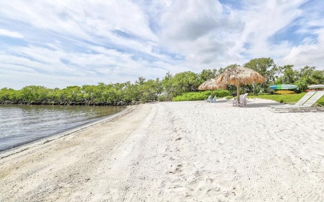 1100 Scotia Dr Unit 102, Hypoluxo, FL 33462 - view of dirt / gravel road featuring a water view