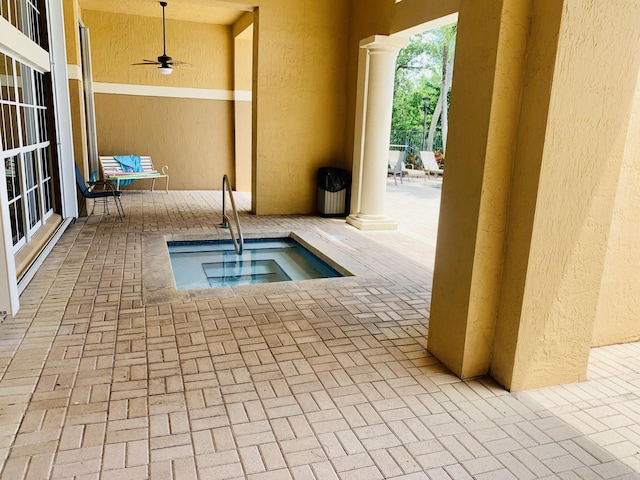 1100 Scotia Dr Unit 102, Hypoluxo, FL 33462 - view of swimming pool featuring ceiling fan, a patio, and a community hot tub