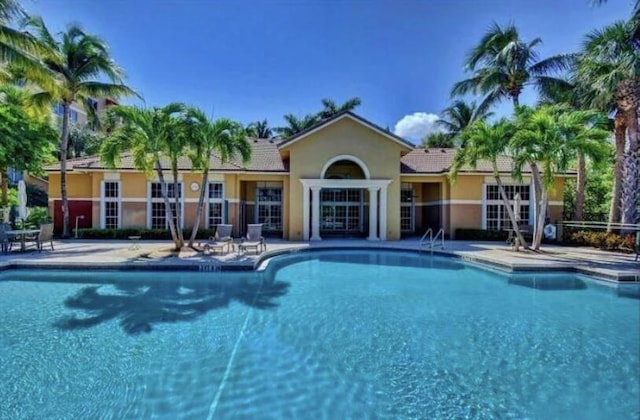 1100 Scotia Dr Unit 102, Hypoluxo, FL 33462 - community pool with a patio