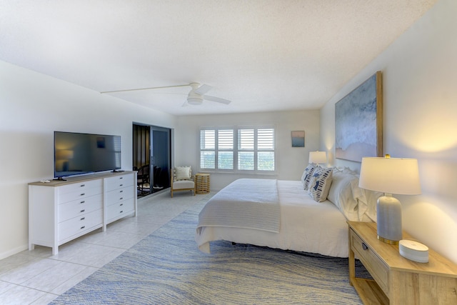 2571 NE Ocean Blvd Unit 104, Stuart, FL 34996 - bedroom with light tile patterned floors and a ceiling fan