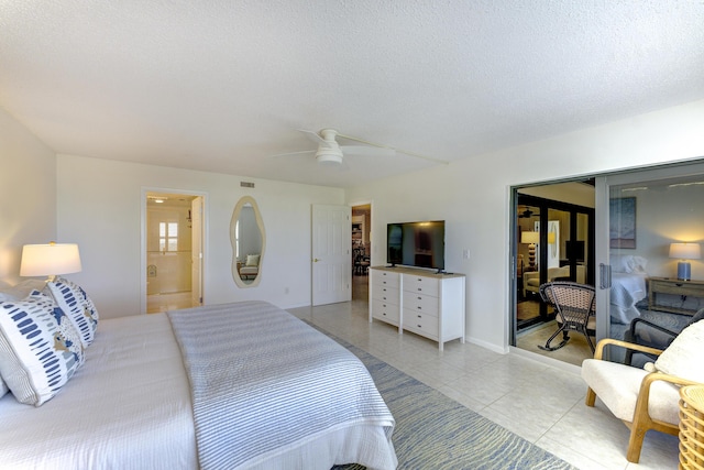 2571 NE Ocean Blvd Unit 104, Stuart, FL 34996 - bedroom with light tile patterned floors, a closet, a ceiling fan, a textured ceiling, and ensuite bath