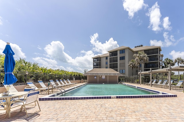 2571 NE Ocean Blvd Unit 104, Stuart, FL 34996 - community pool featuring a patio area
