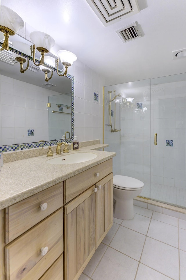 2571 NE Ocean Blvd Unit 104, Stuart, FL 34996 - bathroom with tile patterned floors, vanity, and a shower stall