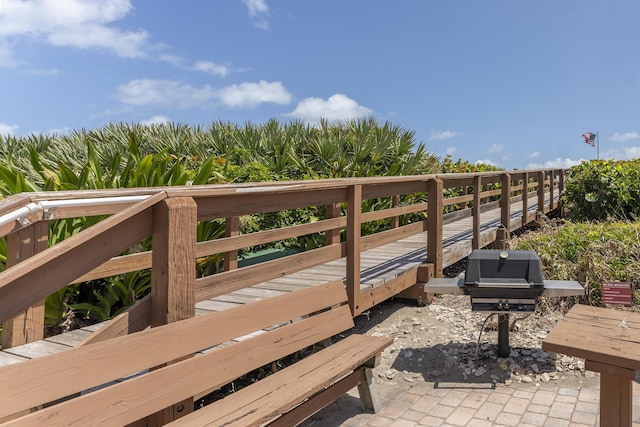 2571 NE Ocean Blvd Unit 104, Stuart, FL 34996 - wooden deck with area for grilling