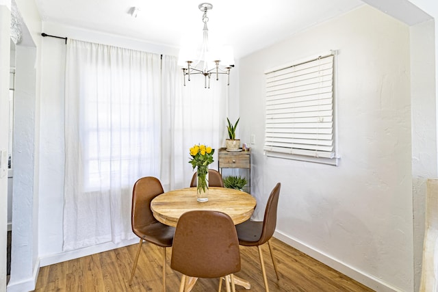 814 Green St, West Palm Beach, FL 33405 - dining room featuring a chandelier and wood finished floors
