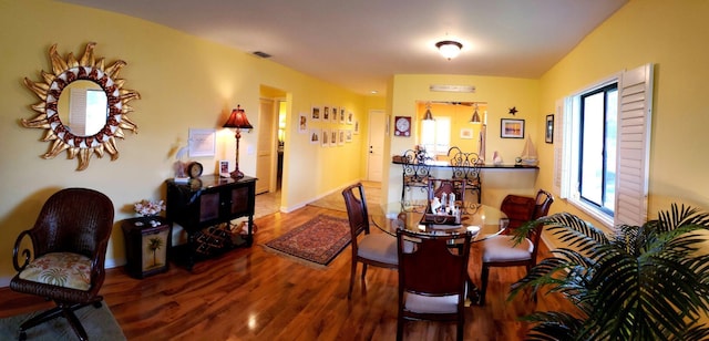 6303 SE Williamsburg Dr Unit 201, Hobe Sound, FL 33455 - dining area with wood finished floors and baseboards