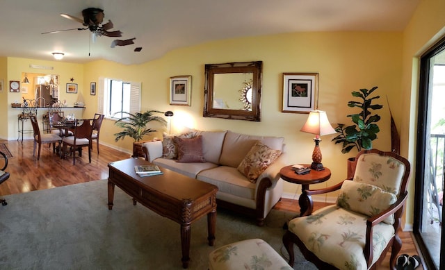 6303 SE Williamsburg Dr Unit 201, Hobe Sound, FL 33455 - living area featuring healthy amount of natural light, ceiling fan, and wood finished floors