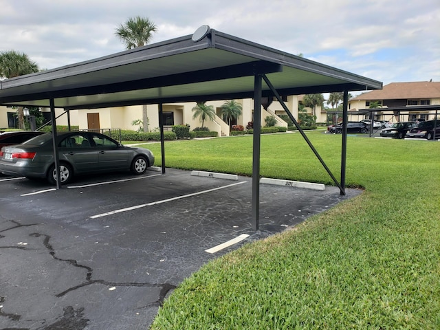 6303 SE Williamsburg Dr Unit 201, Hobe Sound, FL 33455 - view of covered parking lot