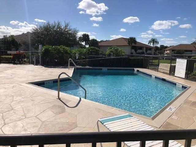 6303 SE Williamsburg Dr Unit 201, Hobe Sound, FL 33455 - community pool featuring a patio area