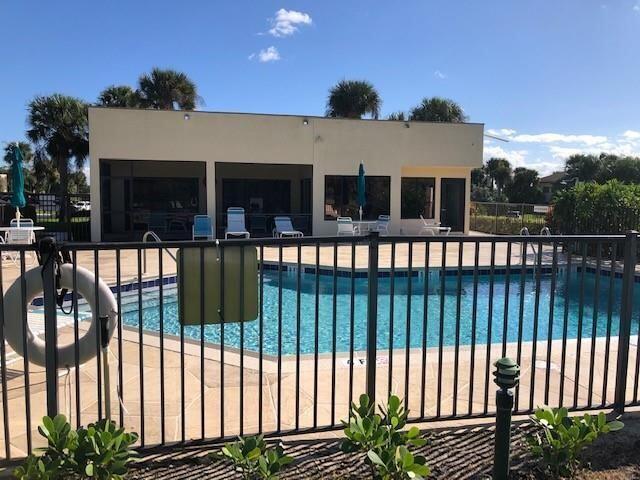 6303 SE Williamsburg Dr Unit 201, Hobe Sound, FL 33455 - community pool with a patio area