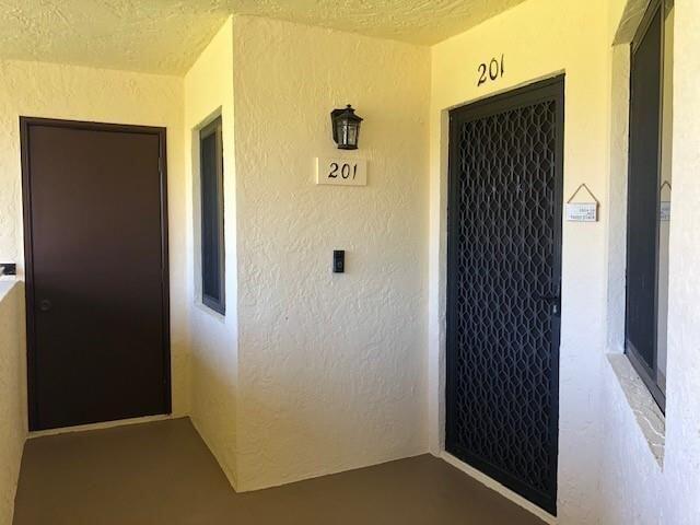 6303 SE Williamsburg Dr Unit 201, Hobe Sound, FL 33455 - view of exterior entry