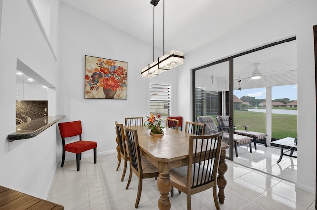 7585 Lexington Club Blvd Unit A, Delray Beach, FL 33446 - dining area with a ceiling fan and light tile patterned flooring