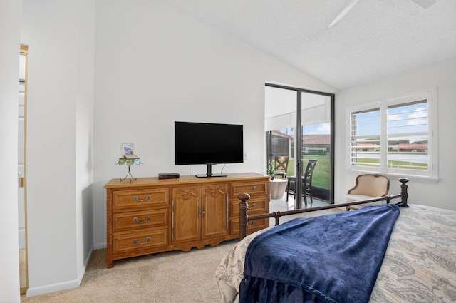 7585 Lexington Club Blvd Unit A, Delray Beach, FL 33446 - bedroom featuring access to exterior, lofted ceiling, light carpet, and a textured ceiling