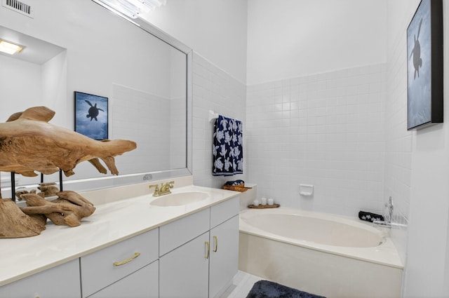7585 Lexington Club Blvd Unit A, Delray Beach, FL 33446 - bathroom featuring a garden tub and vanity