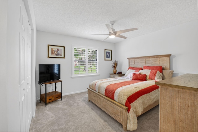 7585 Lexington Club Blvd Unit A, Delray Beach, FL 33446 - bedroom featuring light carpet, a textured ceiling, and a ceiling fan