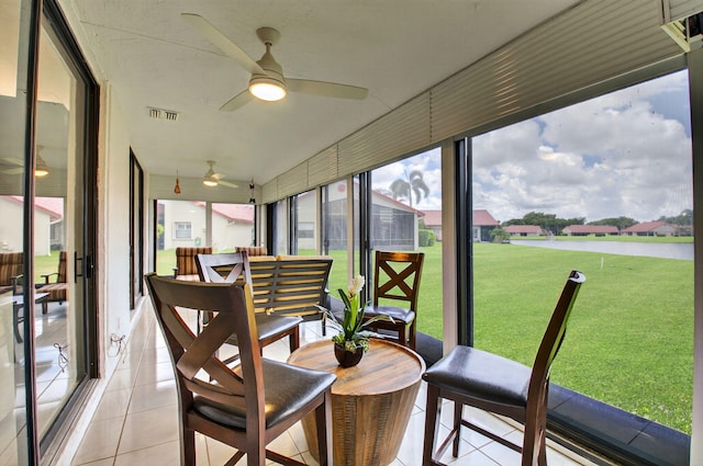 7585 Lexington Club Blvd Unit A, Delray Beach, FL 33446 - sunroom with ceiling fan and an outdoor hangout area