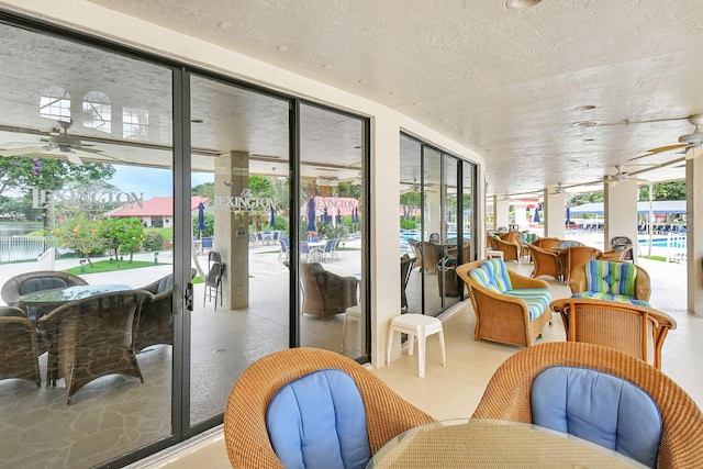 7585 Lexington Club Blvd Unit A, Delray Beach, FL 33446 - sunroom with ceiling fan