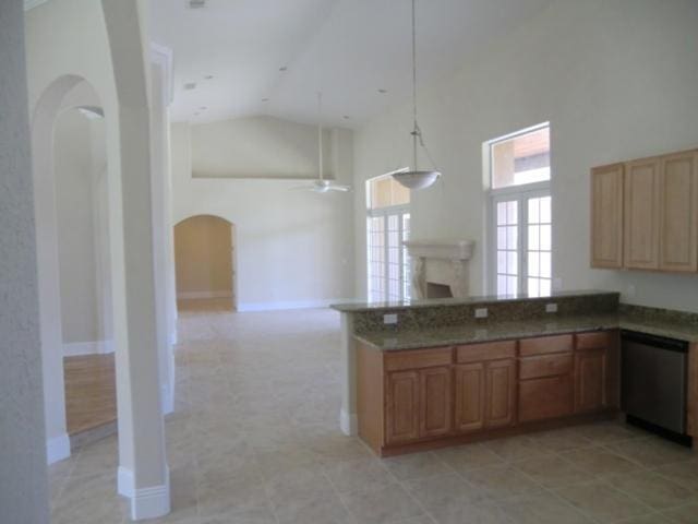 17183 80th St N, The Acreage, FL 33470 - kitchen with arched walkways, high vaulted ceiling, a ceiling fan, dishwasher, and a peninsula