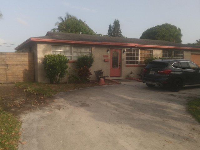 3209 N Australian Ave, West Palm Beach, FL 33407 - single story home with brick siding and concrete driveway