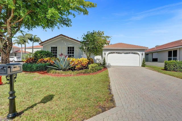 6809 Portside Dr, Boca Raton, FL 33496 - ranch-style house with a front lawn, a garage, decorative driveway, a tile roof, and stucco siding
