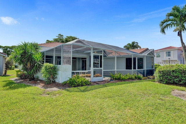 6809 Portside Dr, Boca Raton, FL 33496 - rear view of property with a lawn, a lanai, and stucco siding