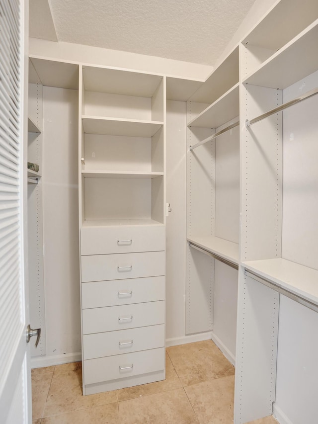 6809 Portside Dr, Boca Raton, FL 33496 - walk in closet featuring light tile patterned floors