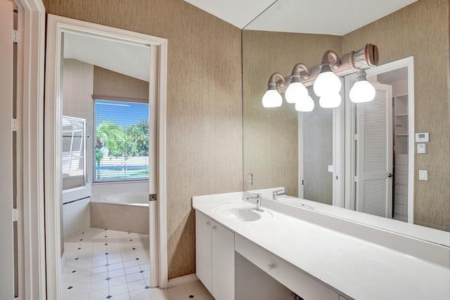 6809 Portside Dr, Boca Raton, FL 33496 - bathroom featuring a bath, vanity, wallpapered walls, and tile patterned floors