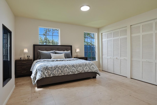 6809 Portside Dr, Boca Raton, FL 33496 - bedroom featuring two closets and light tile patterned floors