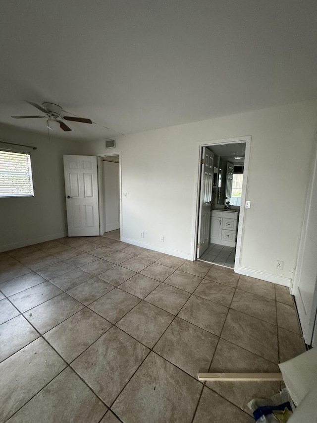 638 Saxony N, Delray Beach, FL 33446 - unfurnished room featuring tile patterned floors and a ceiling fan