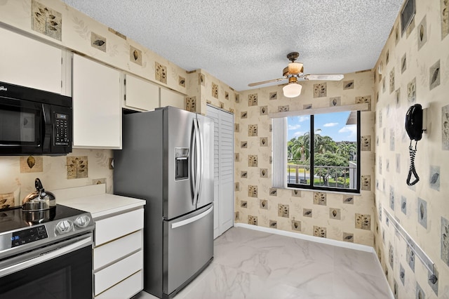 7290 Ashford Pl Unit 201, Delray Beach, FL 33446 - kitchen with stainless steel appliances, wallpapered walls, ceiling fan, light countertops, and a textured ceiling