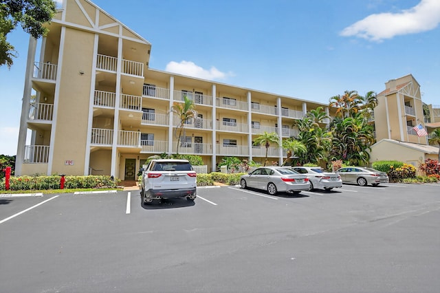 7290 Ashford Pl Unit 201, Delray Beach, FL 33446 - view of apartment building / complex with uncovered parking