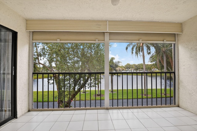 7290 Ashford Pl Unit 201, Delray Beach, FL 33446 - unfurnished sunroom with a water view and plenty of natural light