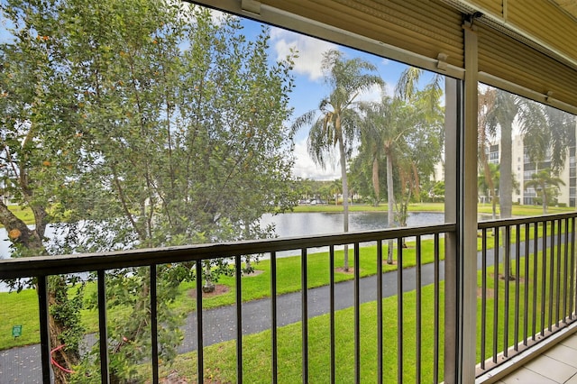 7290 Ashford Pl Unit 201, Delray Beach, FL 33446 - unfurnished sunroom with a water view