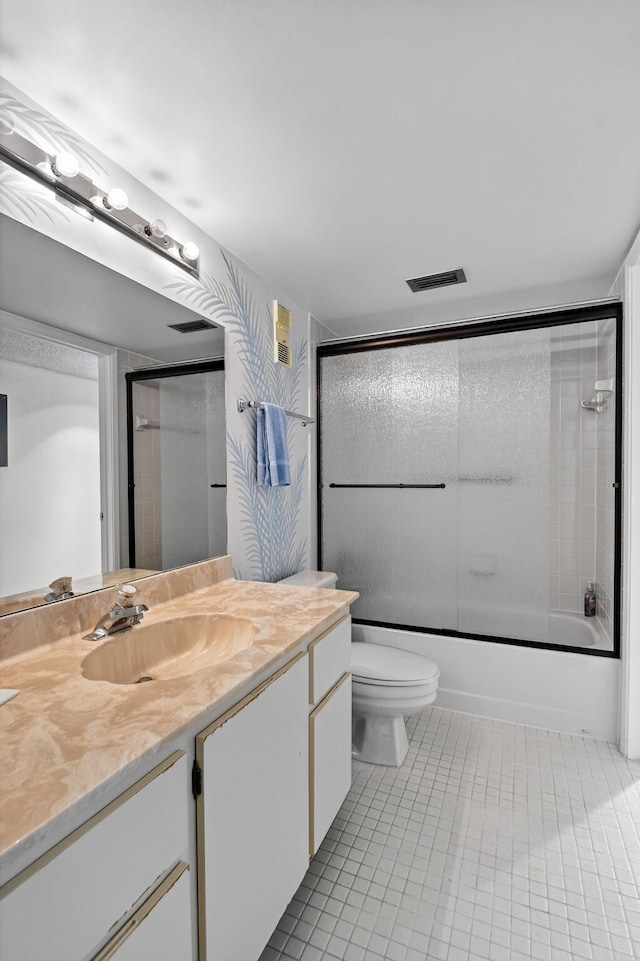 7290 Ashford Pl Unit 201, Delray Beach, FL 33446 - bathroom with vanity, tile patterned floors, and combined bath / shower with glass door