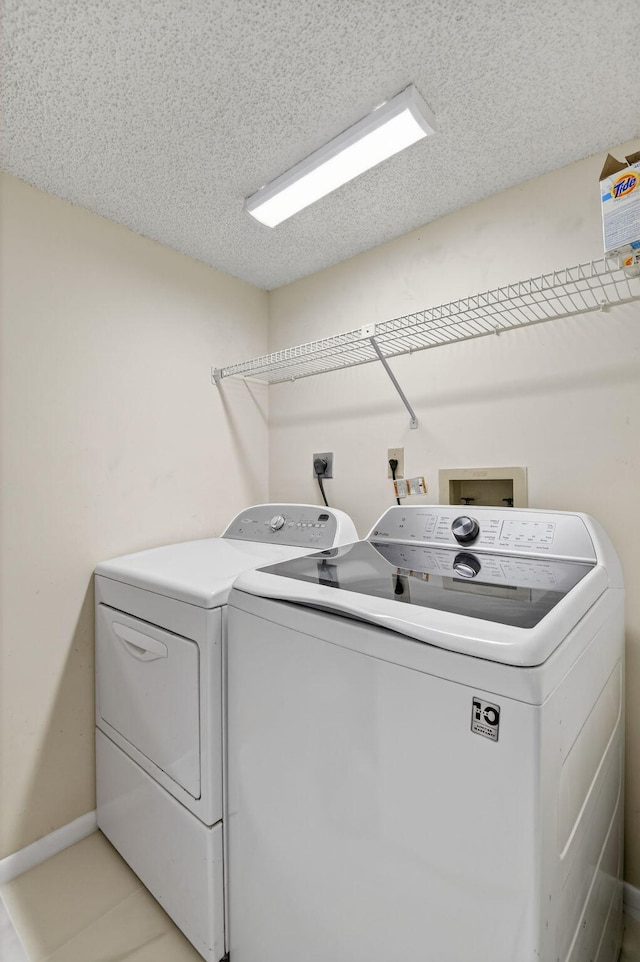 7290 Ashford Pl Unit 201, Delray Beach, FL 33446 - laundry area featuring washer and clothes dryer and a textured ceiling