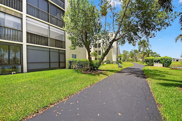 7290 Ashford Pl Unit 201, Delray Beach, FL 33446 - surrounding community featuring a lawn